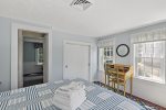 Sunny queen bedroom with dresser and closet with central AC vent